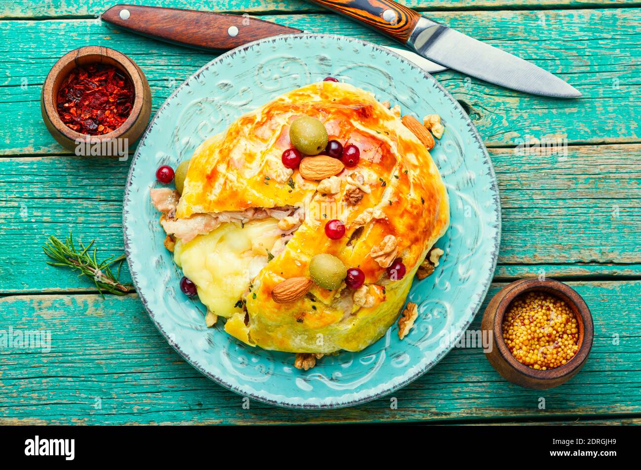 Delicious camembert cheese baked in dough and bacon Stock Photo