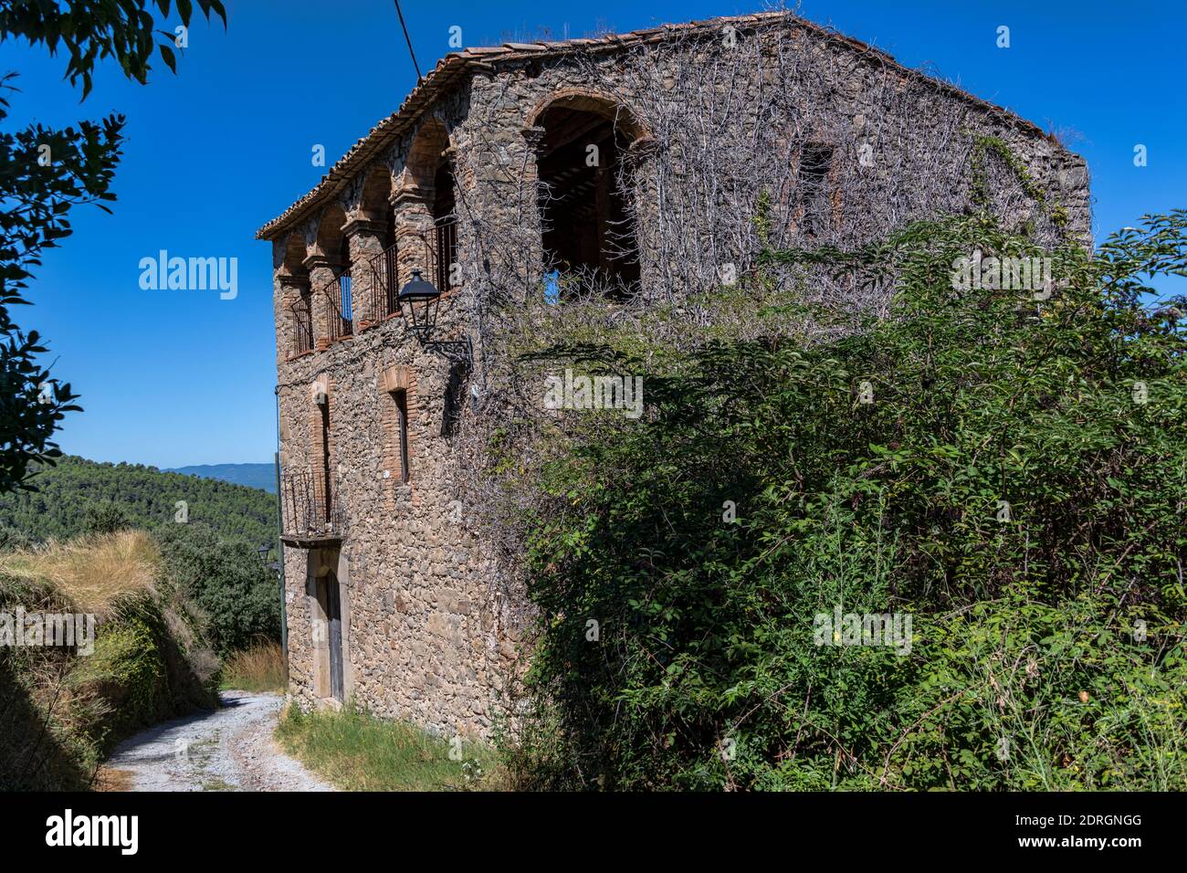 Abandoned farmhouse or masia in the old village of Rocafort, Bages County, Catalonia, Spain. Stock Photo