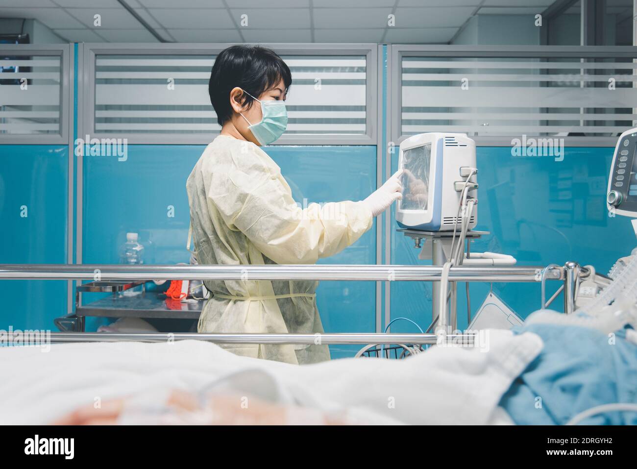 Side View Of Doctor Working In Hospital Stock Photo