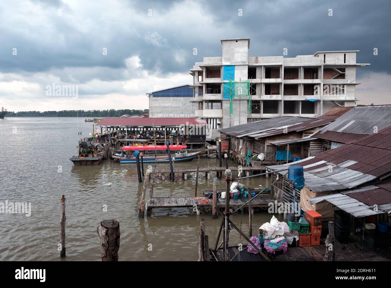 Kuala Sepetang, Malaysia- 27 Oct, 2018: The Kuala Sepetang Jetty with boats, and seafoods restaurant is a famous tourists stop, Perak, Malaysia. - Sce Stock Photo