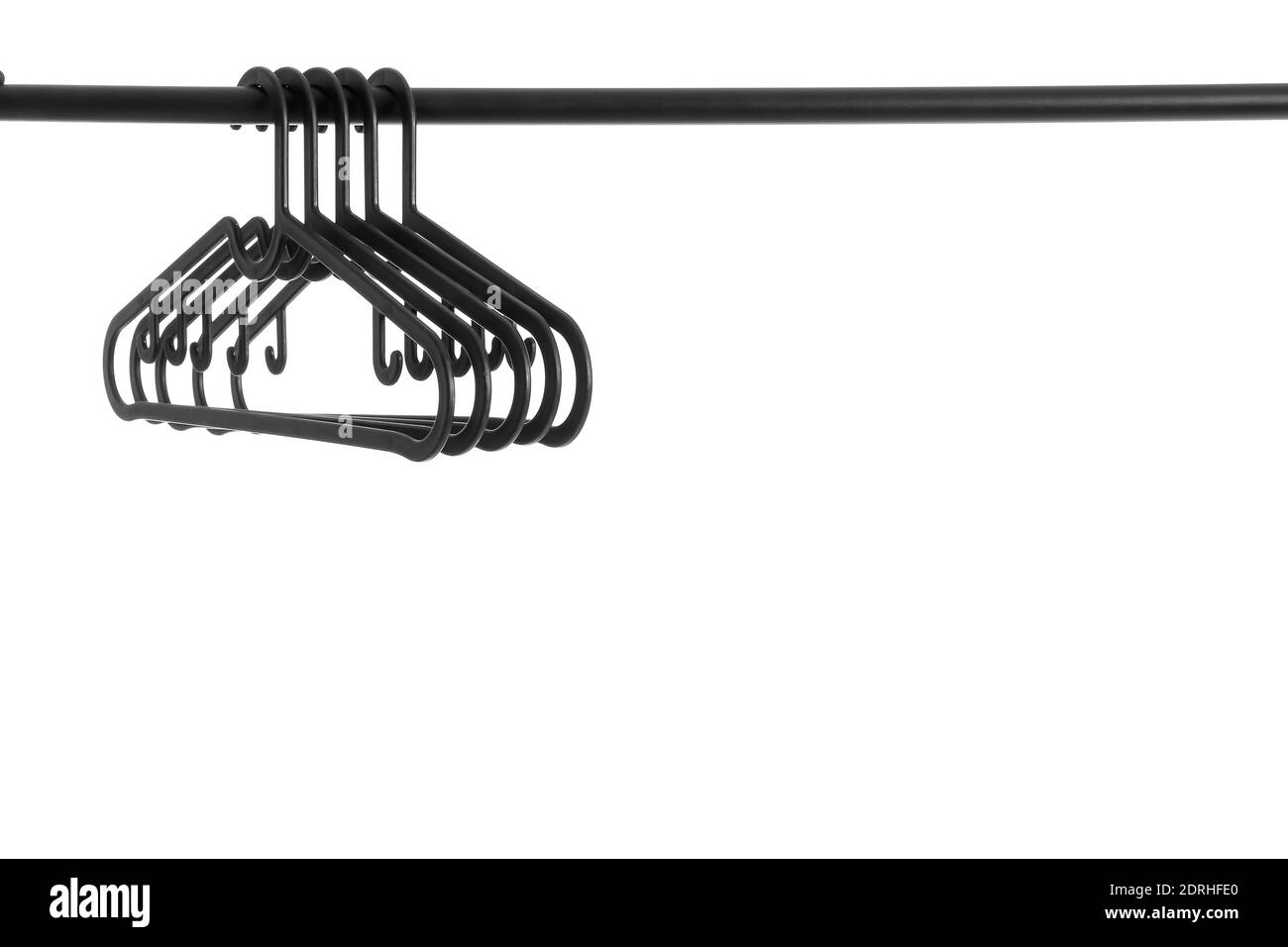 Rack with clothes hangers on white background Stock Photo