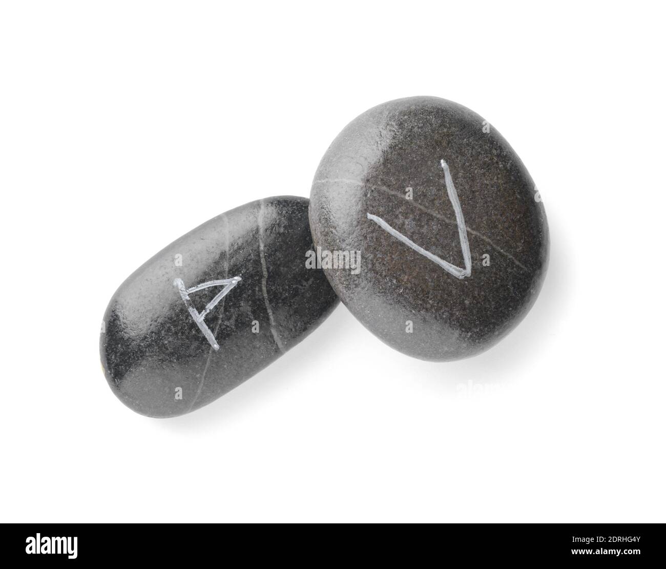 Stones with runes for fortune telling on white background Stock Photo
