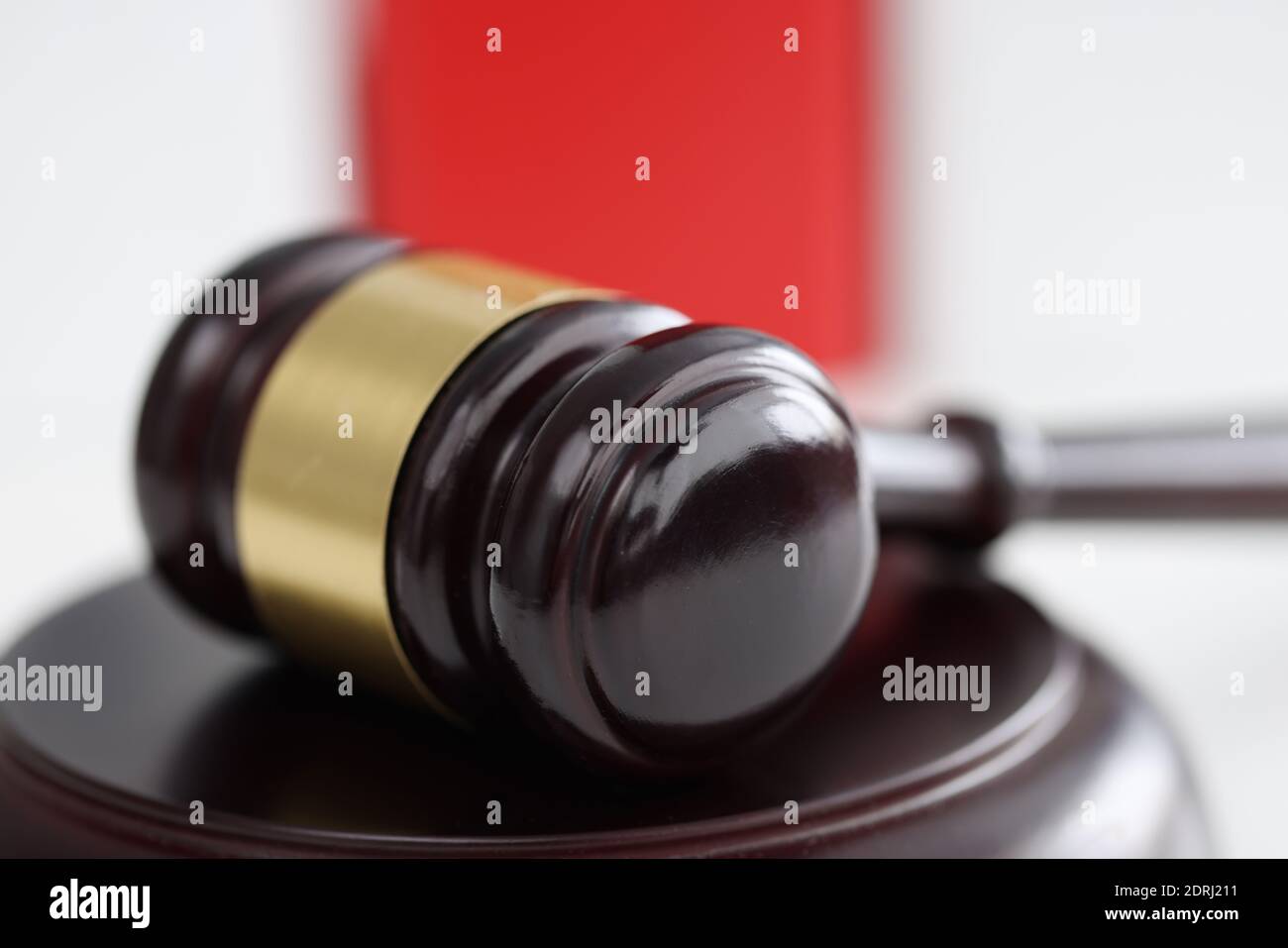 Wooden gavel for judge and auctions lies on stand Stock Photo