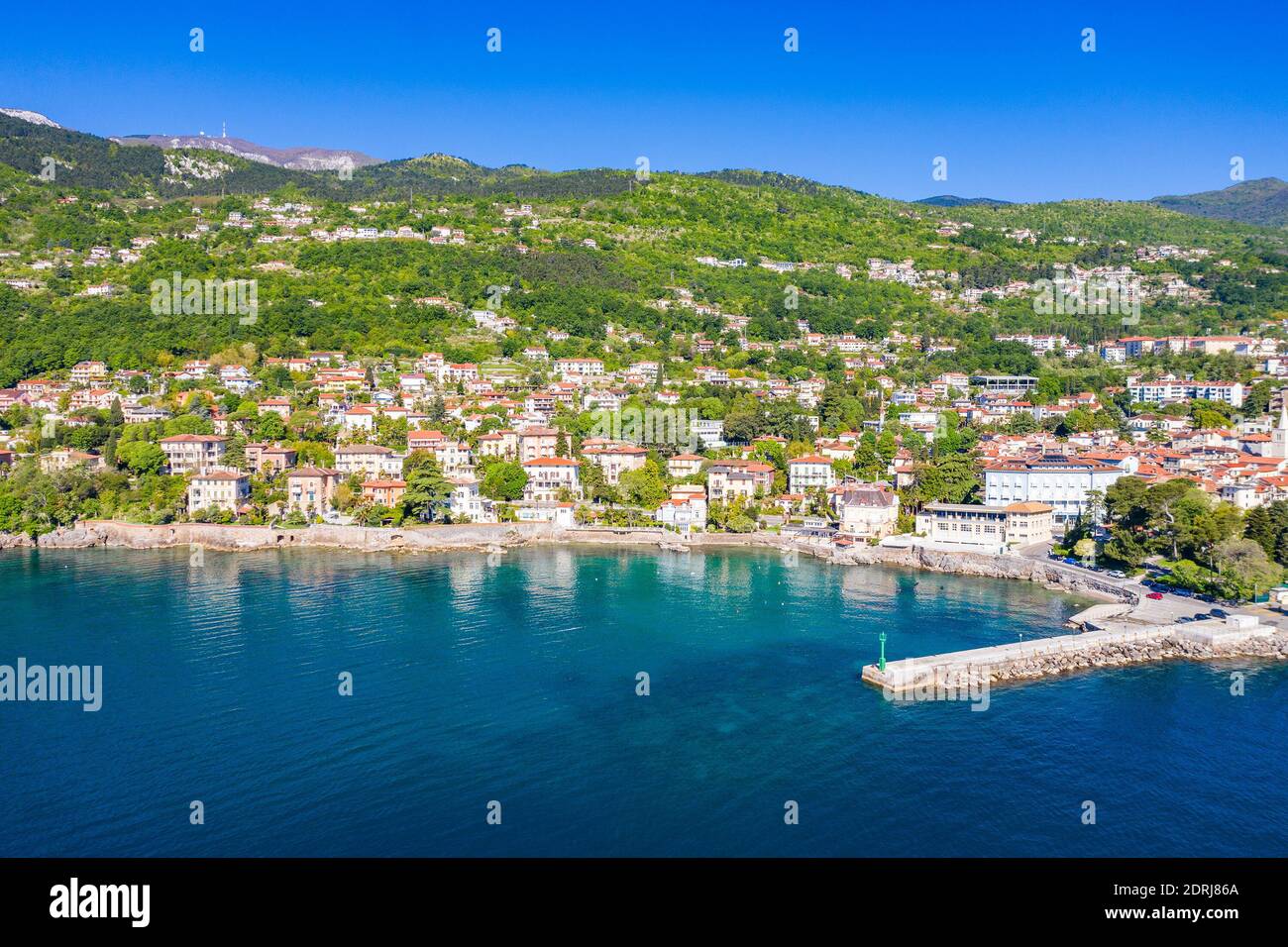 Croatia, beautiful town of Lovran, sea walkway, aerial panoramic view in Kvarner bay coastline, popular tourist destination Stock Photo