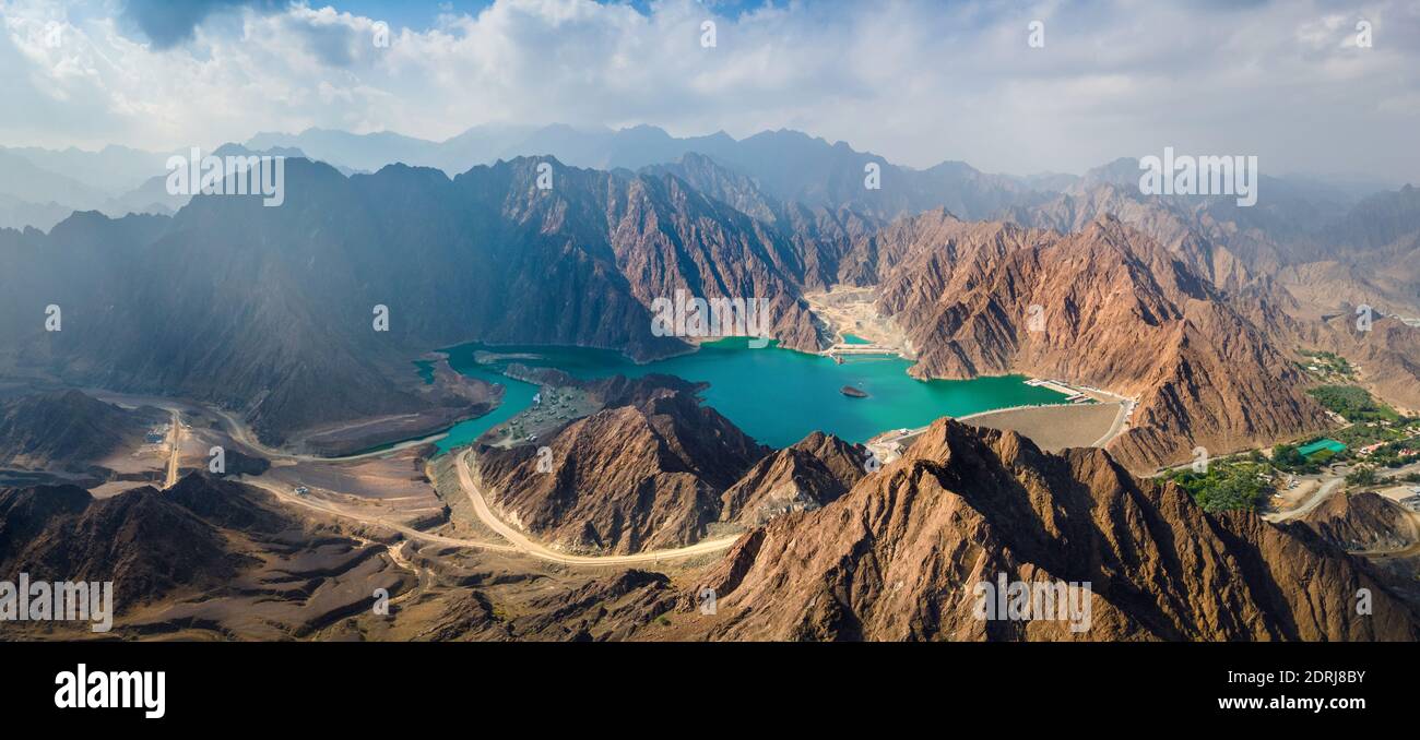 Hatta Dam Lake in mountains enclave region of Dubai, United Arab Emirates aerial panoramic view Stock Photo