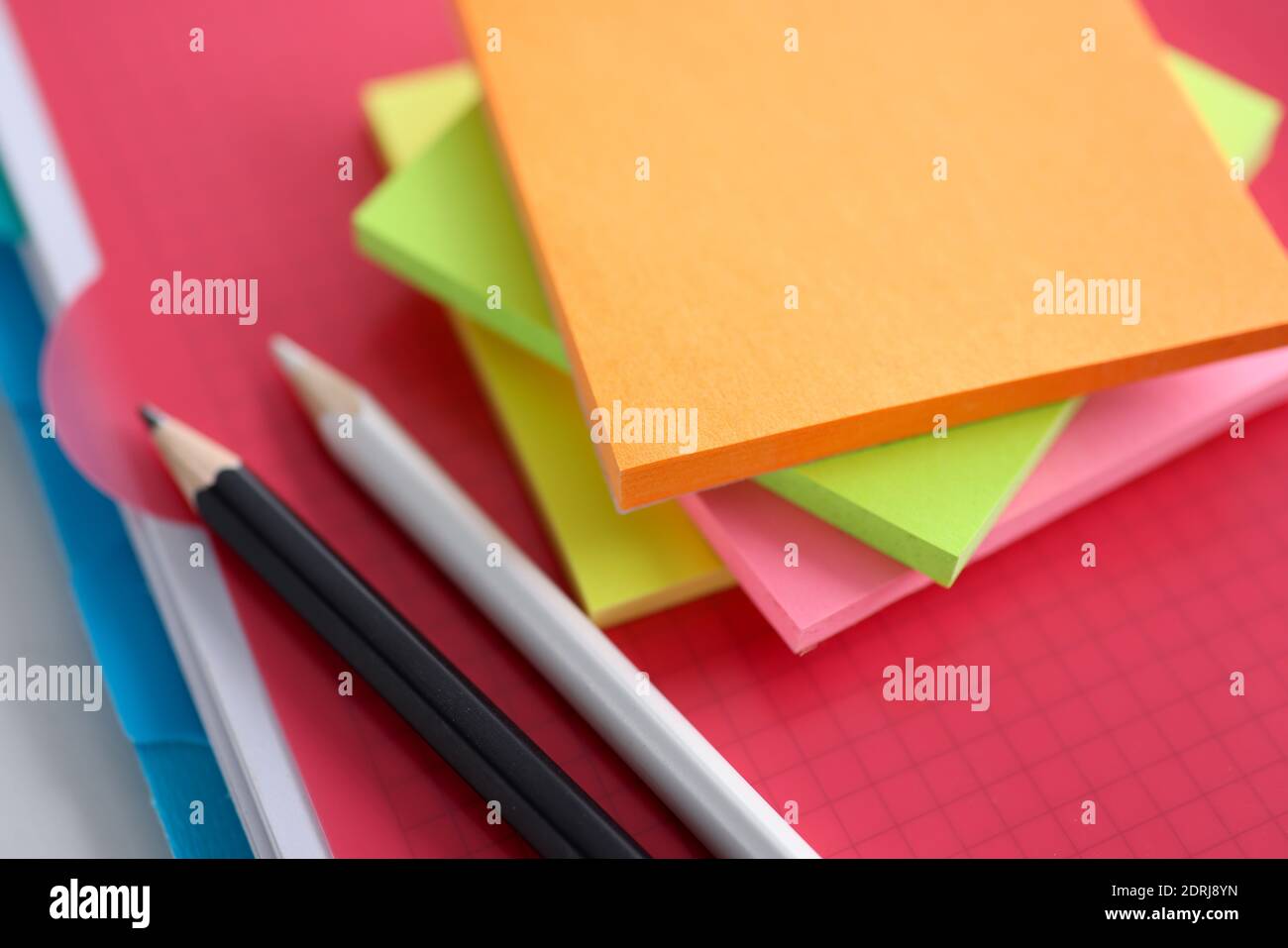 Colored white and black pencil stickers on folder Stock Photo