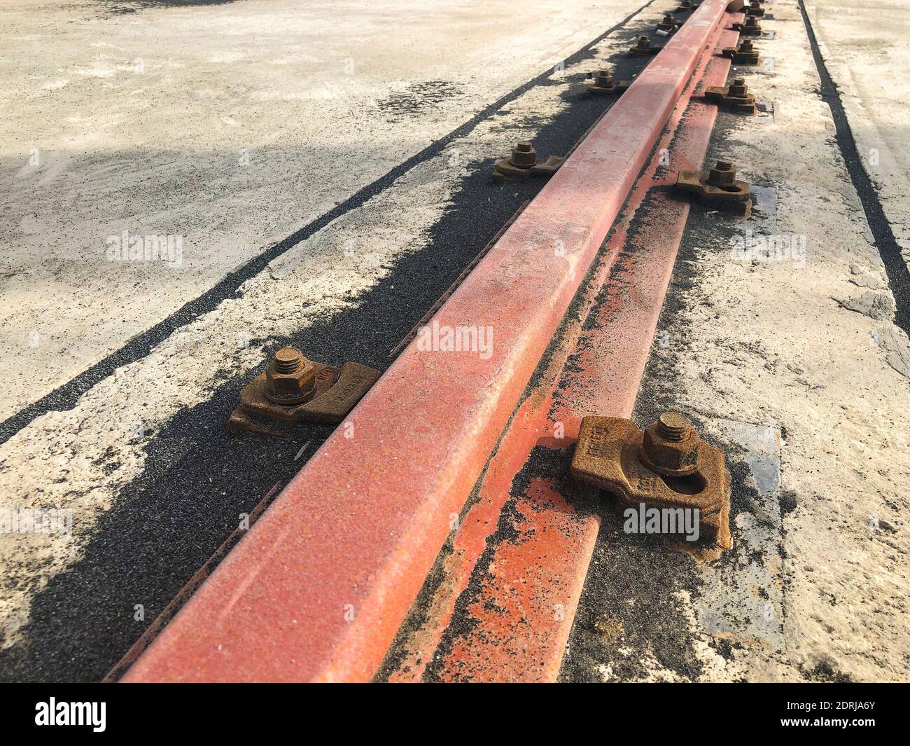 Gantry crane rail fastened to concrete foundation with anchor bolts