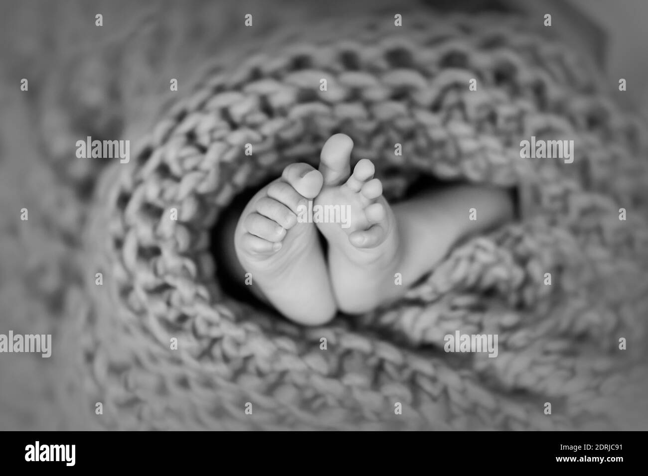 Baby feet wrapped in blanket hires stock photography and images Alamy