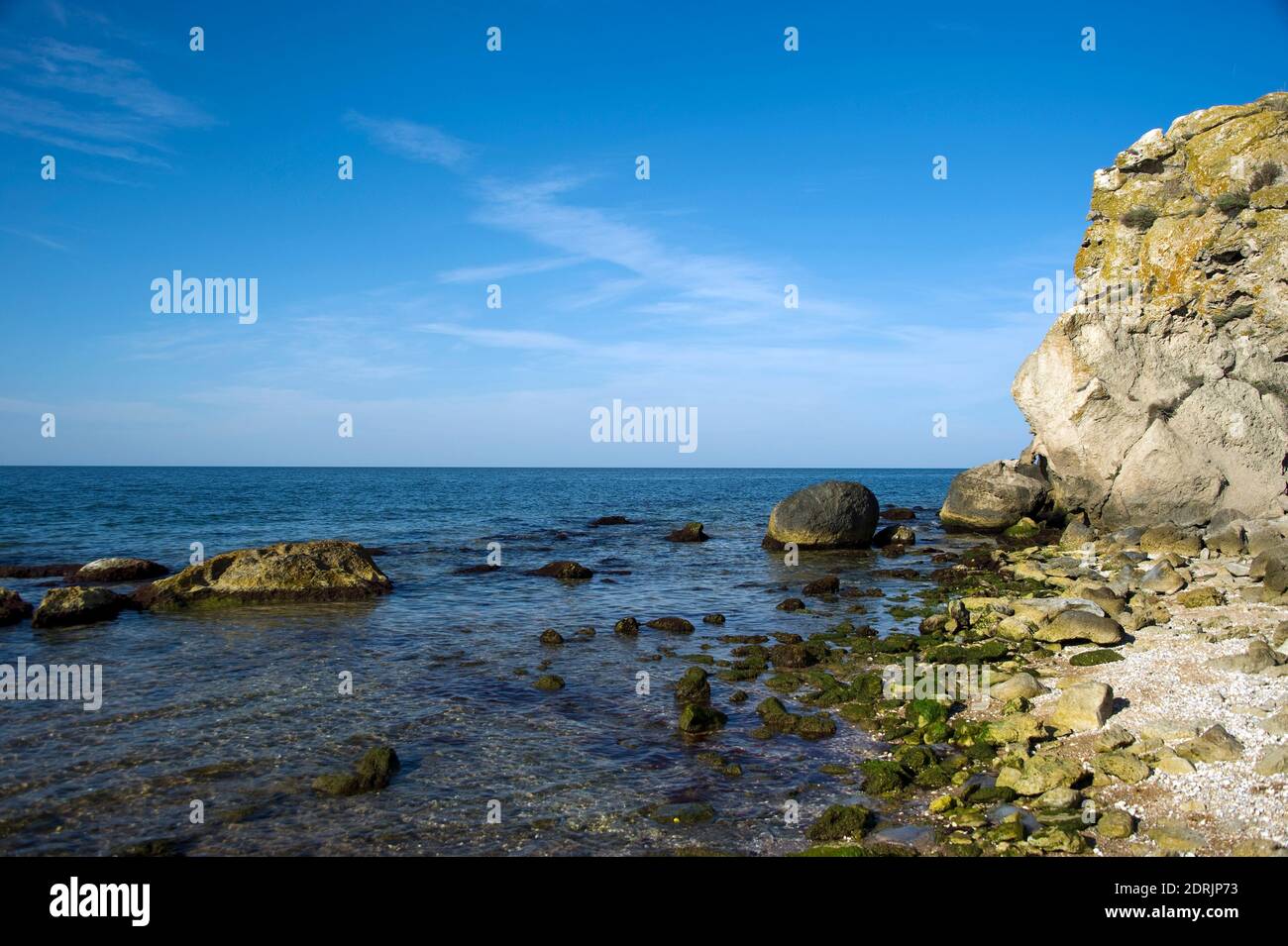 A picturesque bay surrounded by rocks on the Sea of Azov. Stock Photo