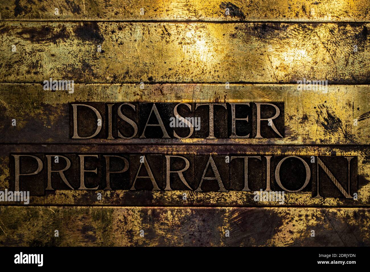 Disaster Preparation text on grunge textured copper and gold background Stock Photo