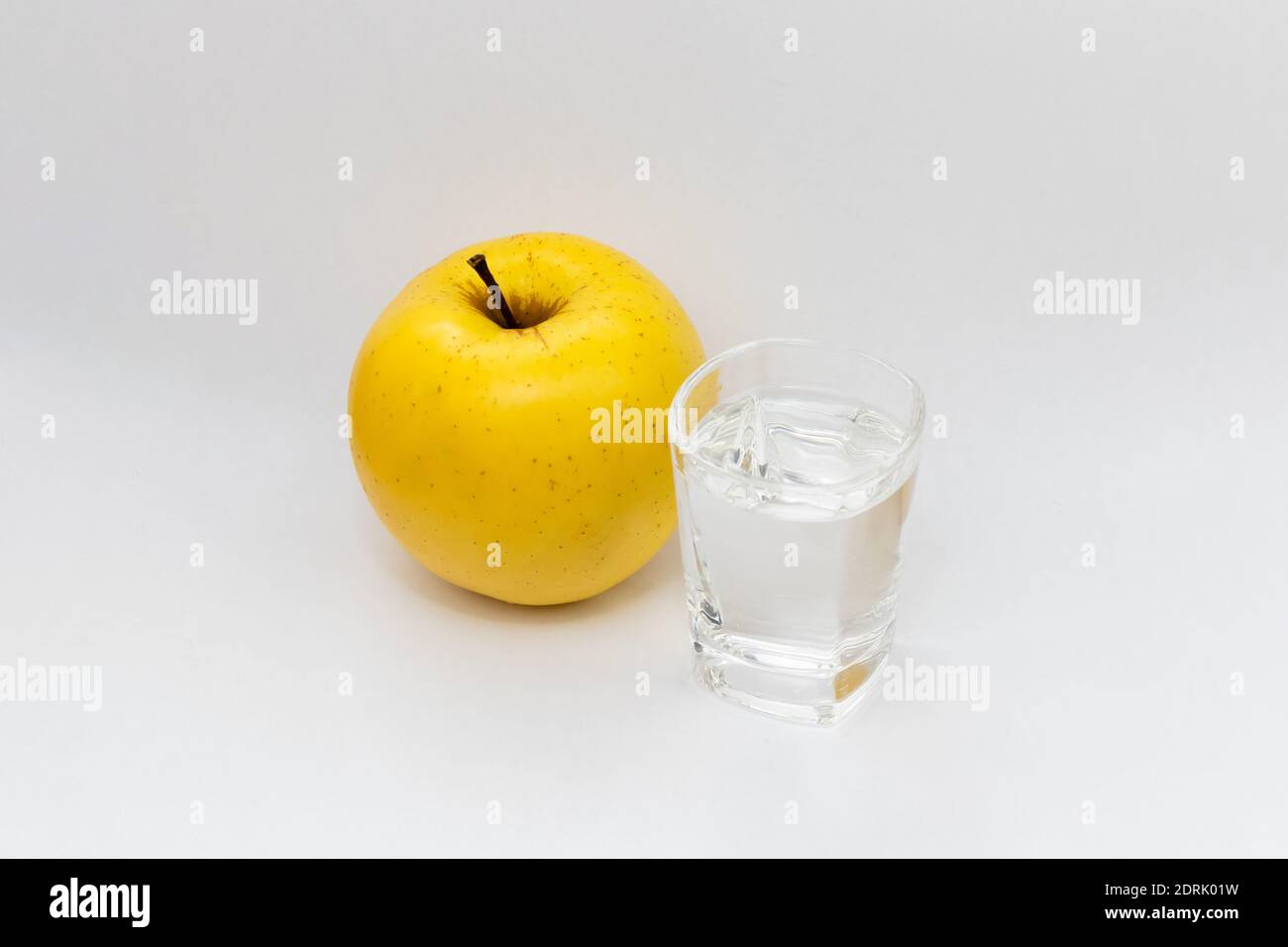Apple alcohol drink in a glass. Rakija was made from golden delicious apples Stock Photo Alamy