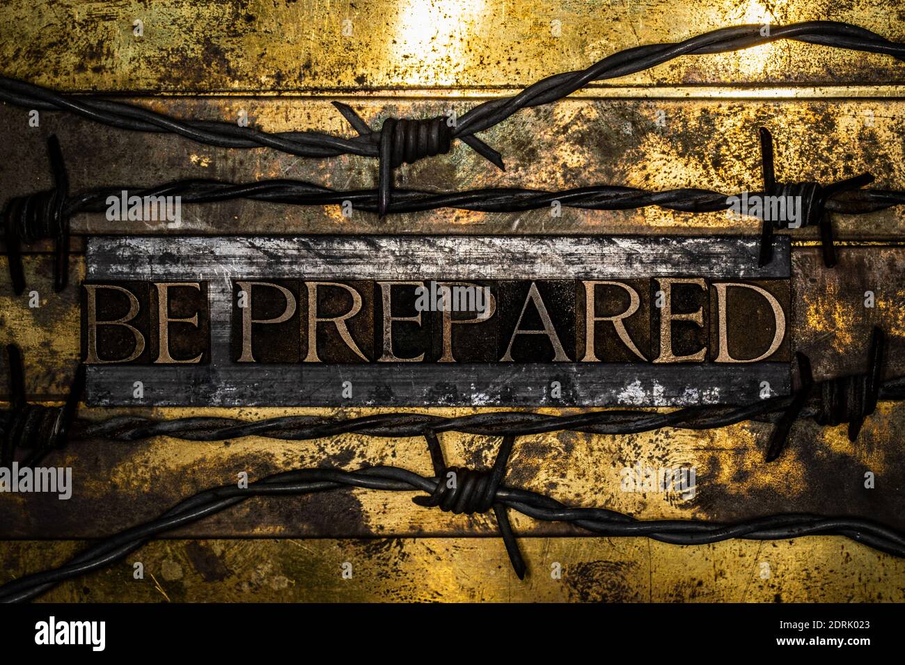 Be Prepared text between barbed wire on vintage textured grunge copper and gold background Stock Photo