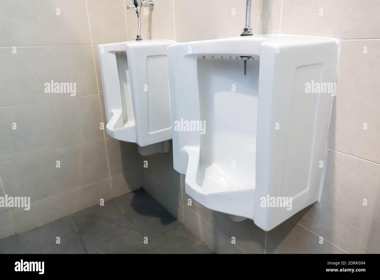 White Urinals In Bathroom Stock Photo Alamy