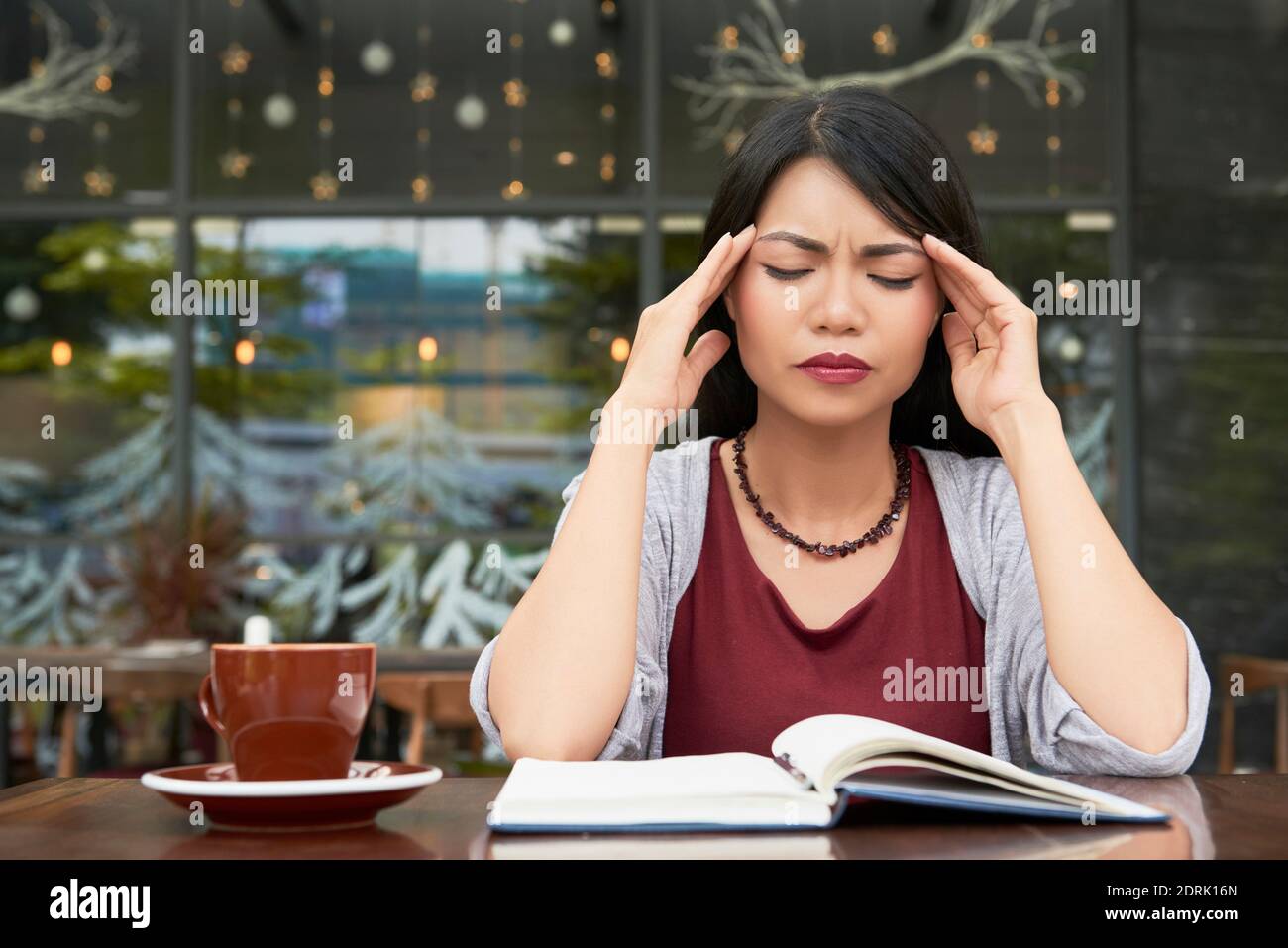 Woman suffering from headache Stock Photo