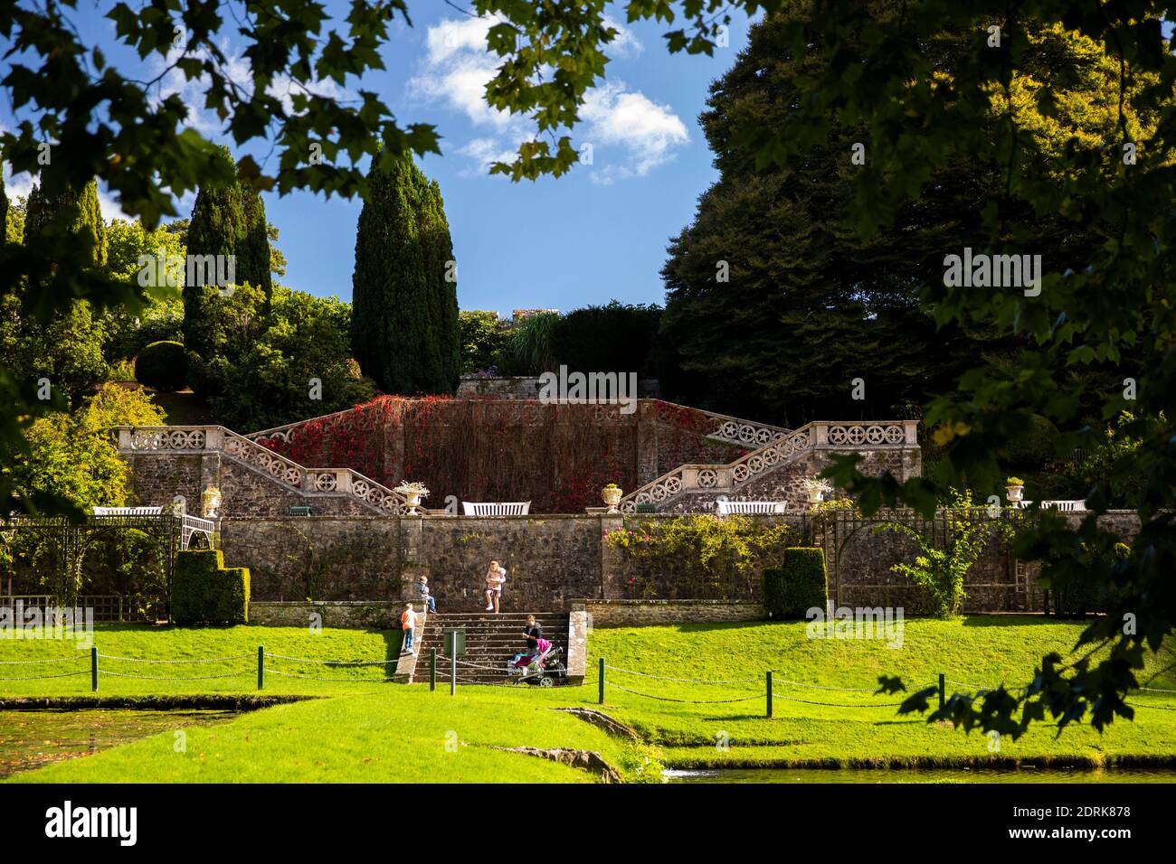 UK, Wales, Cardiff, St Fagans, National Museum of History, visitors in castle formal gardens at terrace to ponds Stock Photo