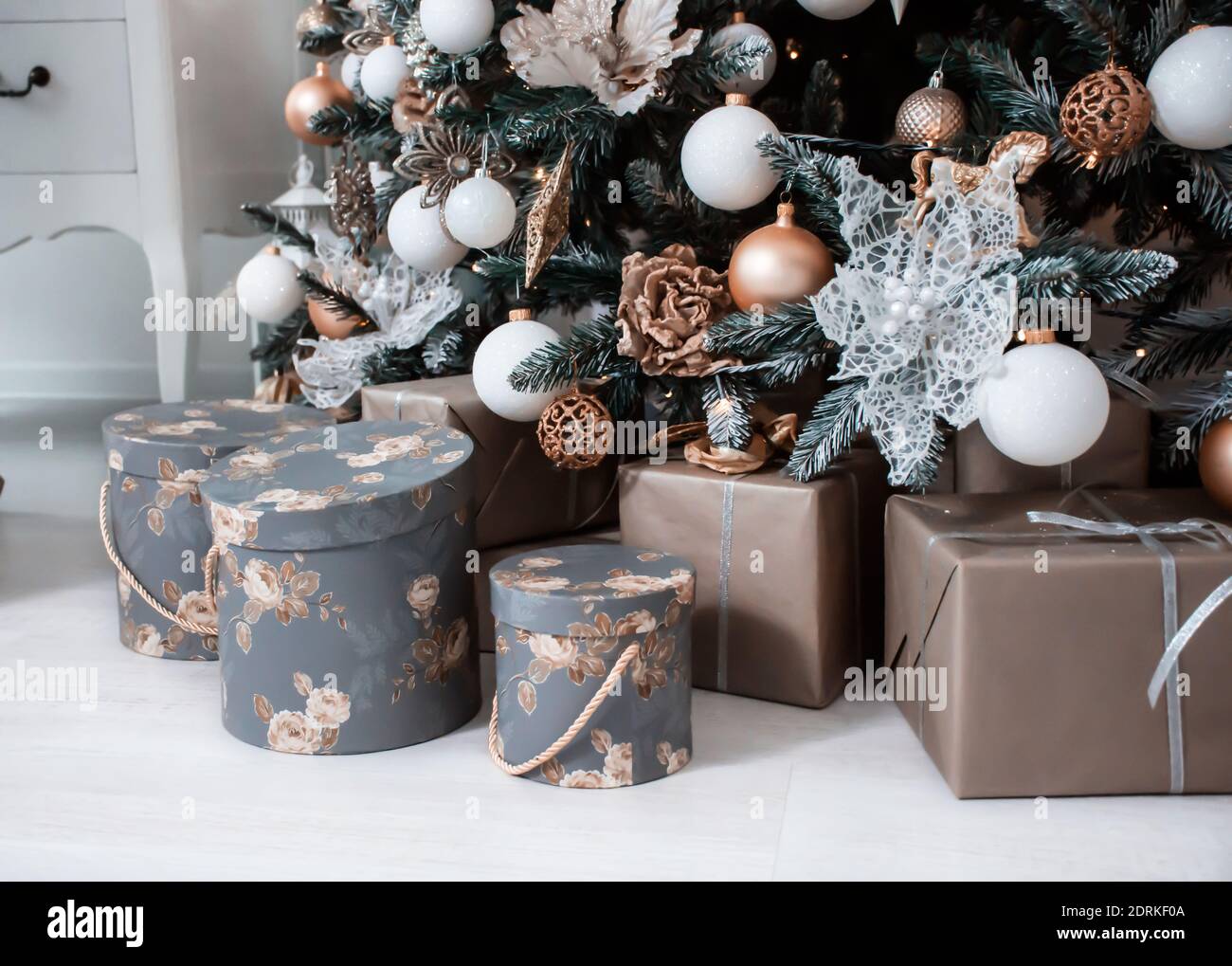 many different boxes with gifts under the tree Stock Photo