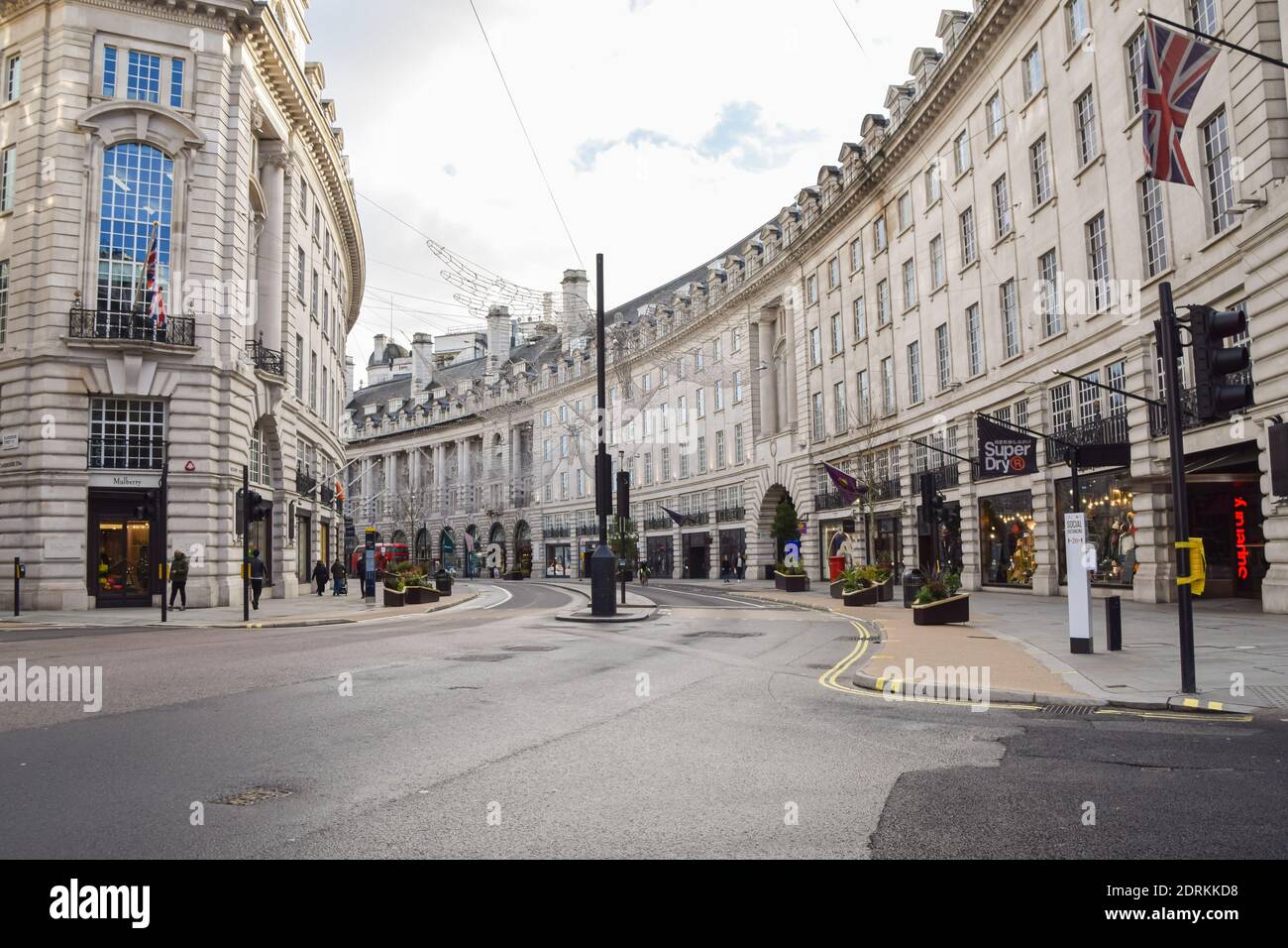 A view of a deserted Regent Street, as shops and businesses close once again. London has imposed even tougher restrictions as cases surge and a new strain of COVID-19 emerges in the capital and the South East of England. Stock Photo