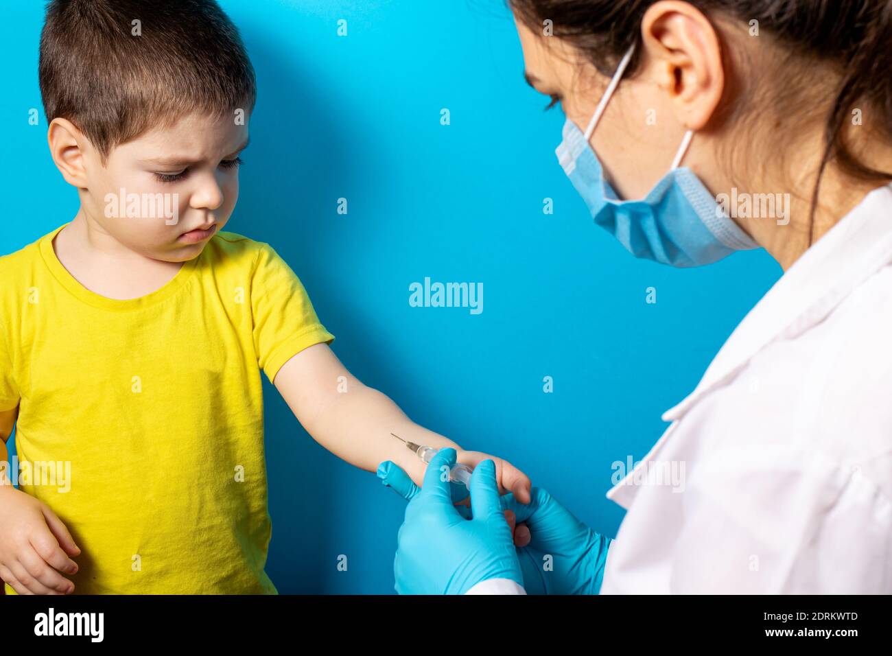 A doctor or nurse does a Mantoux test for a small baby boy. Tuberculosis test, vaccination. Intradermal tuberculin injection Stock Photo