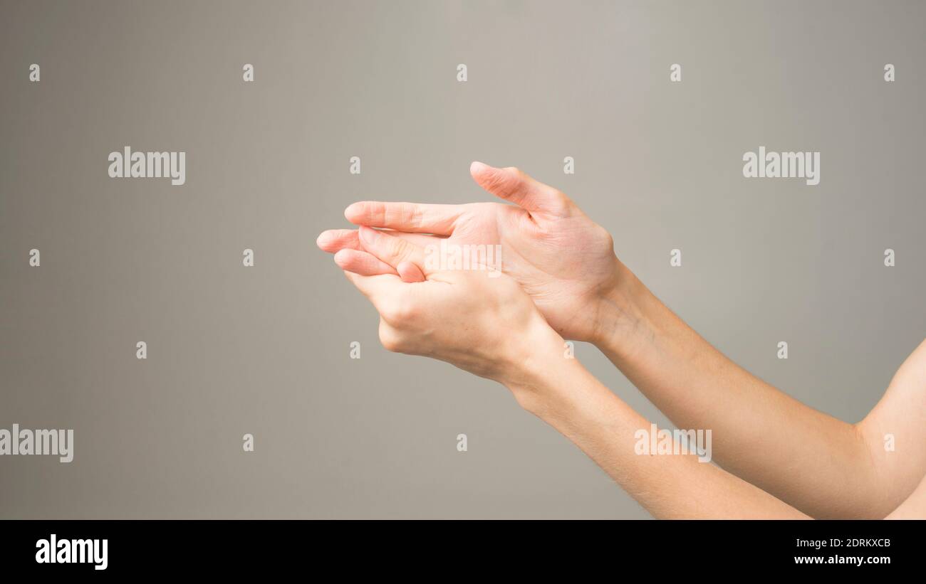 Parkinson's disease symptoms. Close up of tremor (shaking) hands of