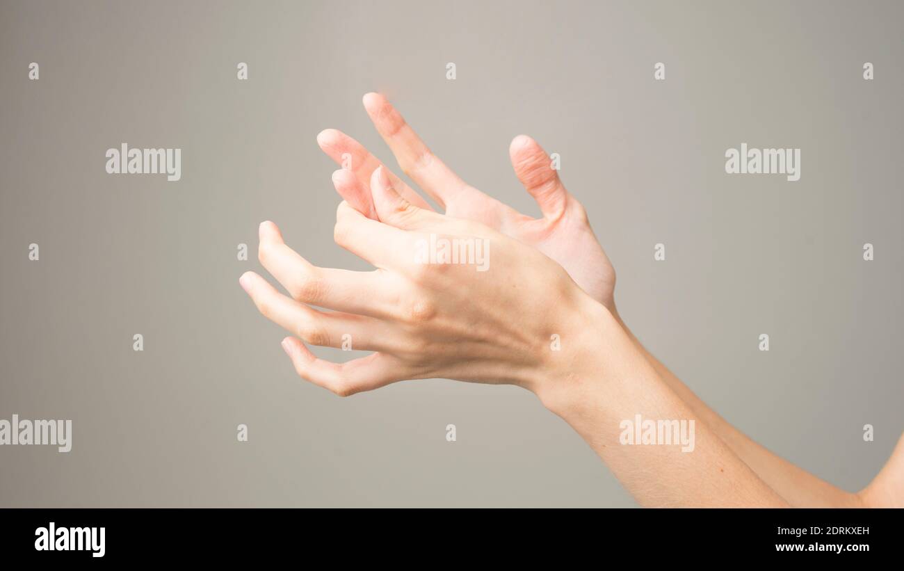 Parkinson's disease symptoms. Close up of tremor (shaking) hands of