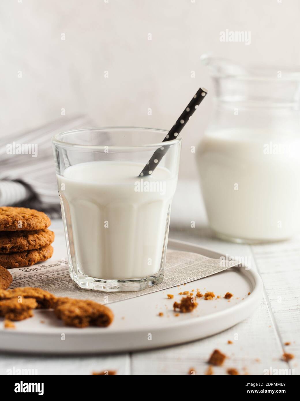A glass of milk, cookies, a jug of milk. The concept of milk, the use