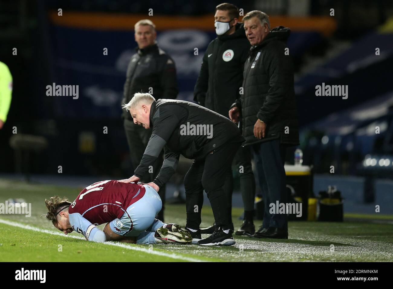 Sammy Lee, the West Bromwich Albion assistant coach checks on Jack Grealish of Aston Villa after he is fouled by Jake Livermore who gets a red card for the tackle. Premier League, West Bromwich Albion v Aston Villa at the Hawthorns in West Bromwich, Midlands on Sunday 20th December 2020. this image may only be used for Editorial purposes. Editorial use only, license required for commercial use. No use in betting, games or a single club/league/player publications. pic by Andrew Orchard/Andrew Orchard sports photography/Alamy Live news Stock Photo