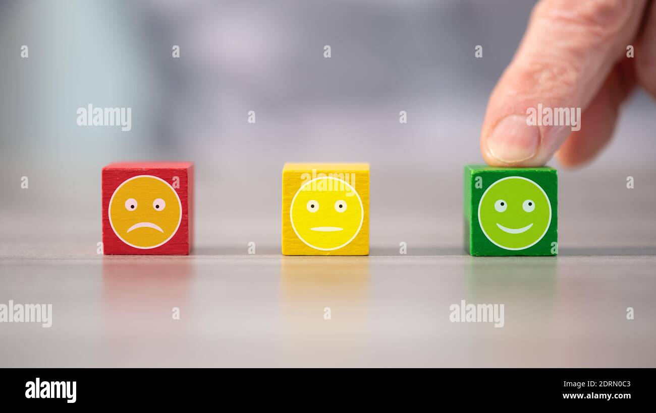 Customer service evaluation concept with wooden cubes Stock Photo - Alamy