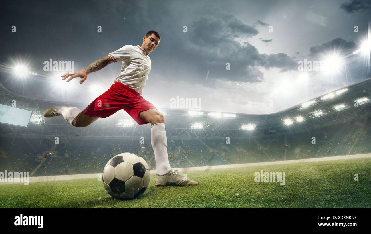 pro soccer player kicking ball