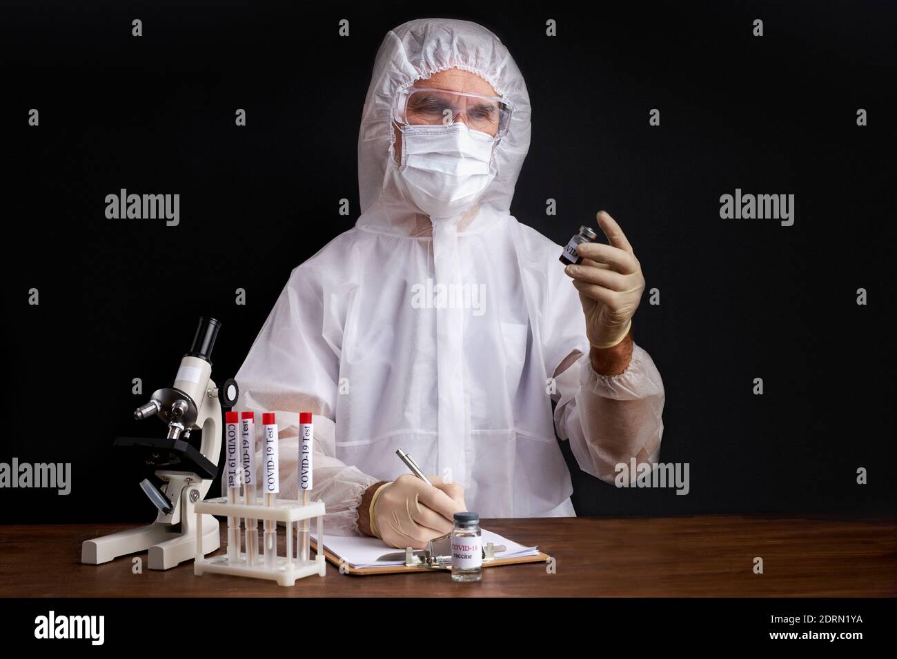 male scientist is testing a sample of biological tubes contaminated by ...