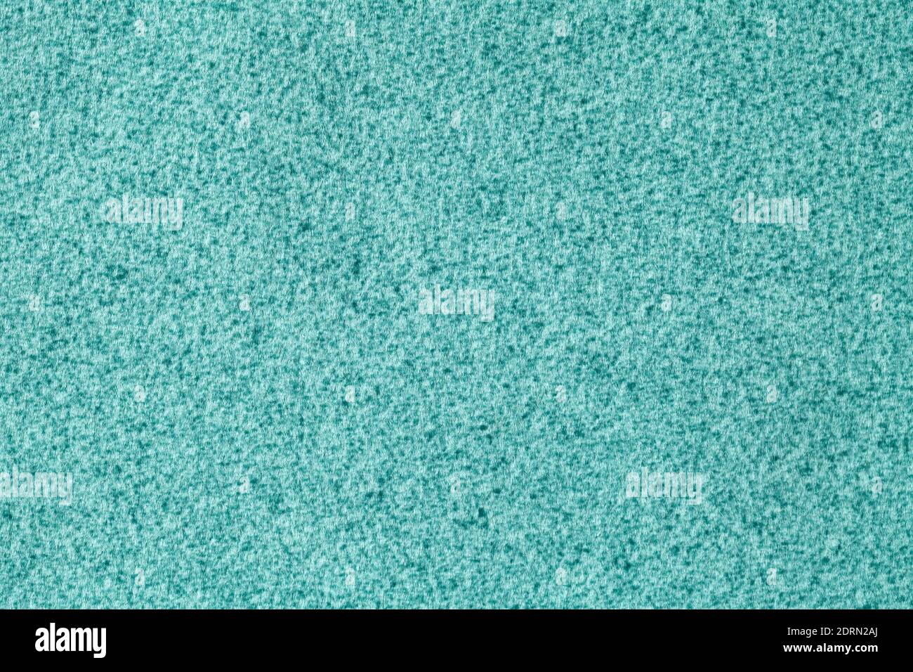 Light blue fluffy background of soft, velour fabric. Texture of turquoise wool textile backdrop