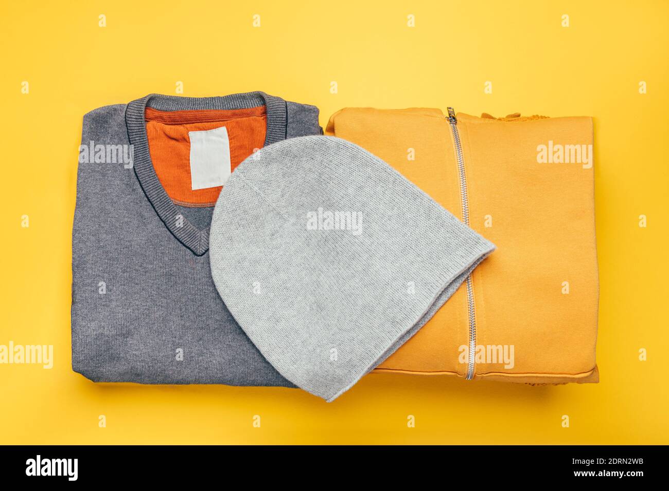 Stacks of gray and yellow clothing Stock Photo