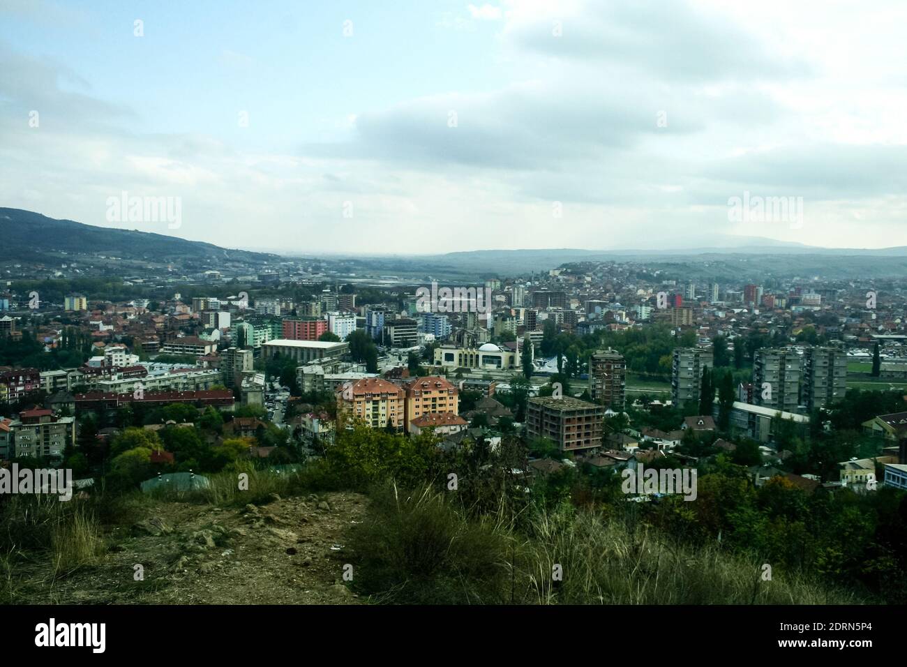 panorama ofNorth Mitrovica, the serbian part of the town, with South mitrovica in background, It is a symbol of the division between albanians and ser Stock Photo