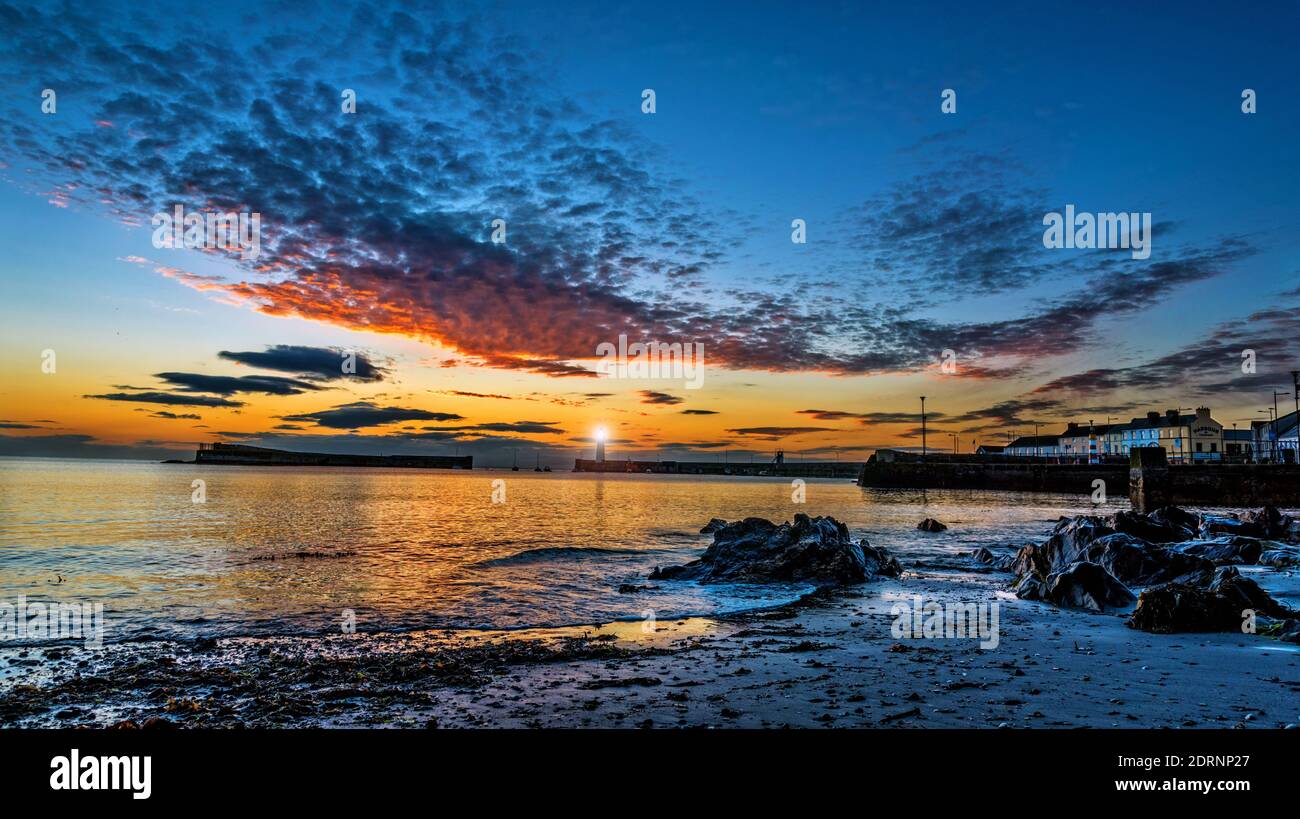Just a few minutes before actual sunrise on midsummer morning at Donaghadee harbour, County Down, Northern Ireland Stock Photo