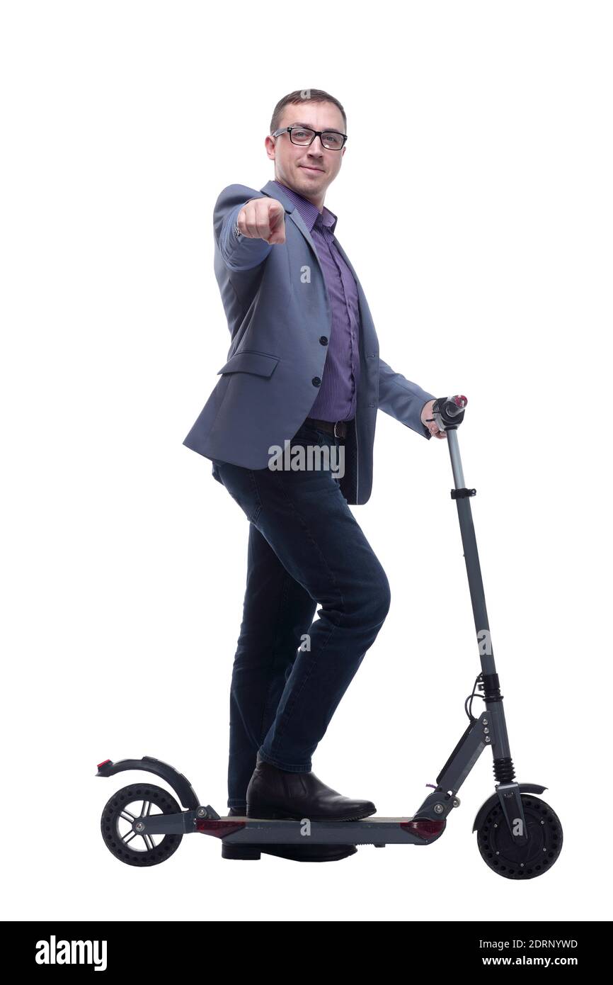 Pleasant smiling man riding a kick scooter Stock Photo