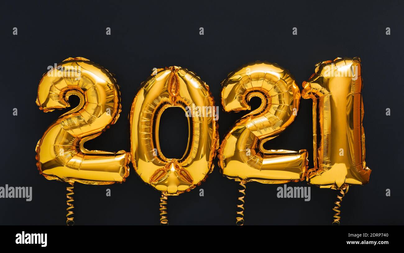 2021 year Christmas gold air balloons on black background. Happy New year 2021 eve. Long web banner Stock Photo