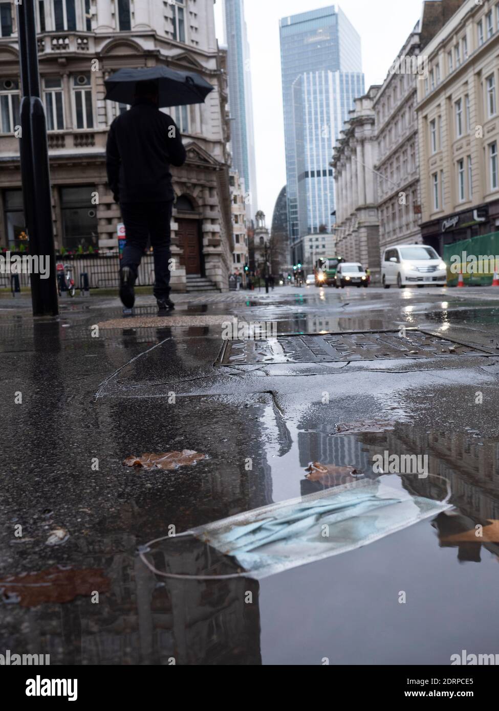 Ppe mask lies in a puddle hi-res stock photography and images - Alamy