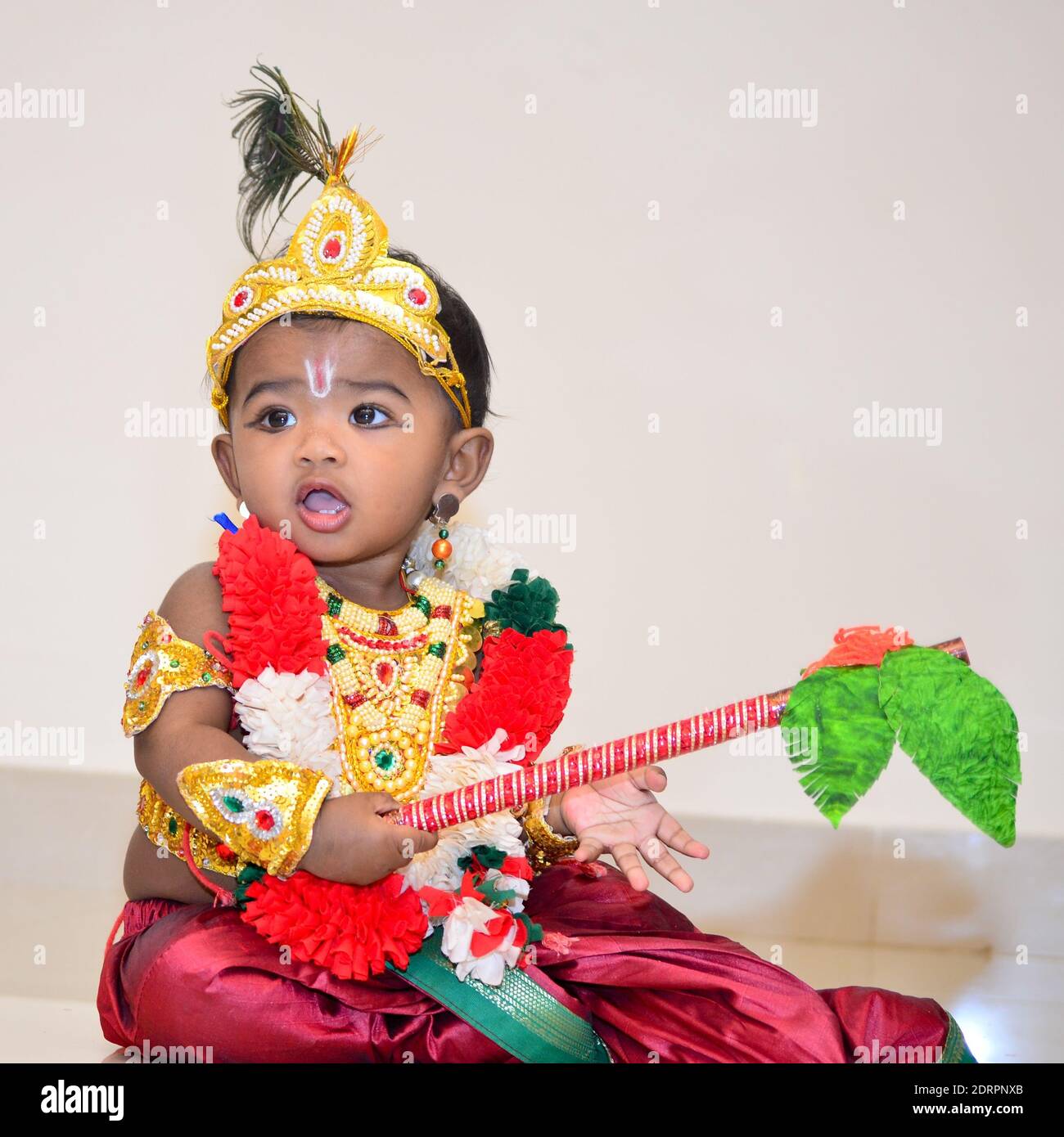 Cute Girl In Krishna Costume Playing At Home Stock Photo - Alamy