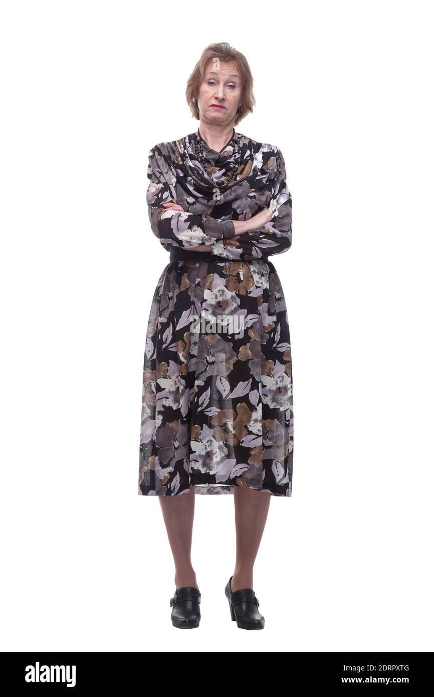 Portrait of skeptical, serious senior mature woman looking suspicious, disapproval on face, arms crossed folded, isolated white background Stock Photo