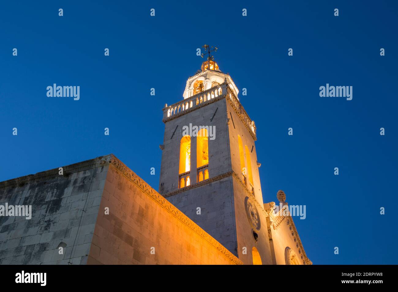 Korčula Town, Korčula, Dubrovnik-Neretva, Croatia. The illuminated bell-tower of St Mark's Cathedral, dusk. Stock Photo