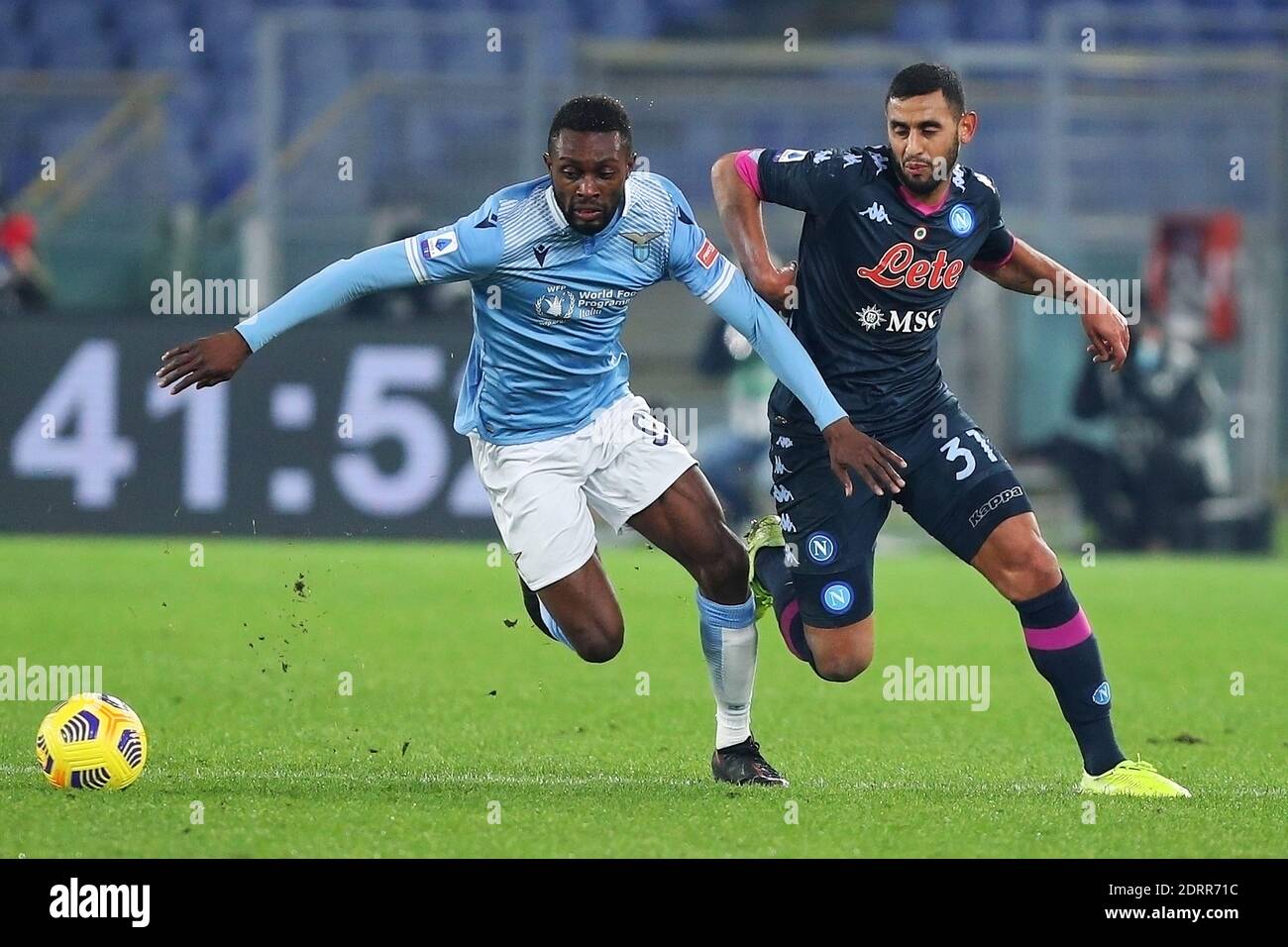 Jean Daniel Akpa Akpro of Lazio (L) vies for the ball with Faouzi Ghoulam of Napoli (R) during the Italian championship Serie A football match between SS Lazio and SSC Napoli on December 20, 2020 at Stadio Olimpico in Rome, Italy - Photo Federico Proietti / DPPI / LM Stock Photo
