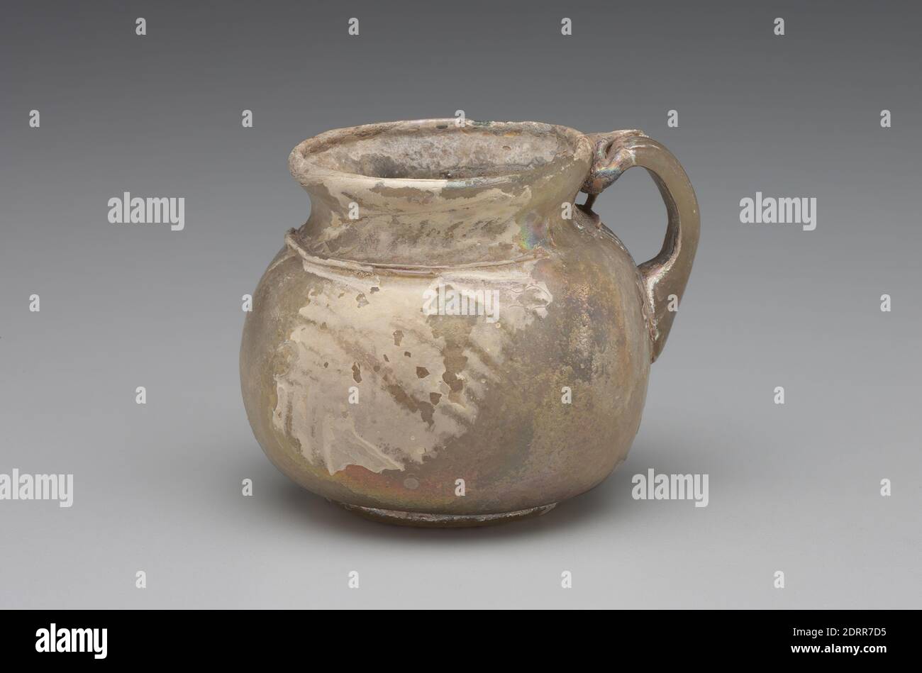 Ovoid Jug, 3rd–4th century A.D., Free-blown glass, pale yellowish green, 1 15/16 in. (5 cm), Roman, Eastern Mediterranean, Roman-Byzantine, Containers - Glass Stock Photo