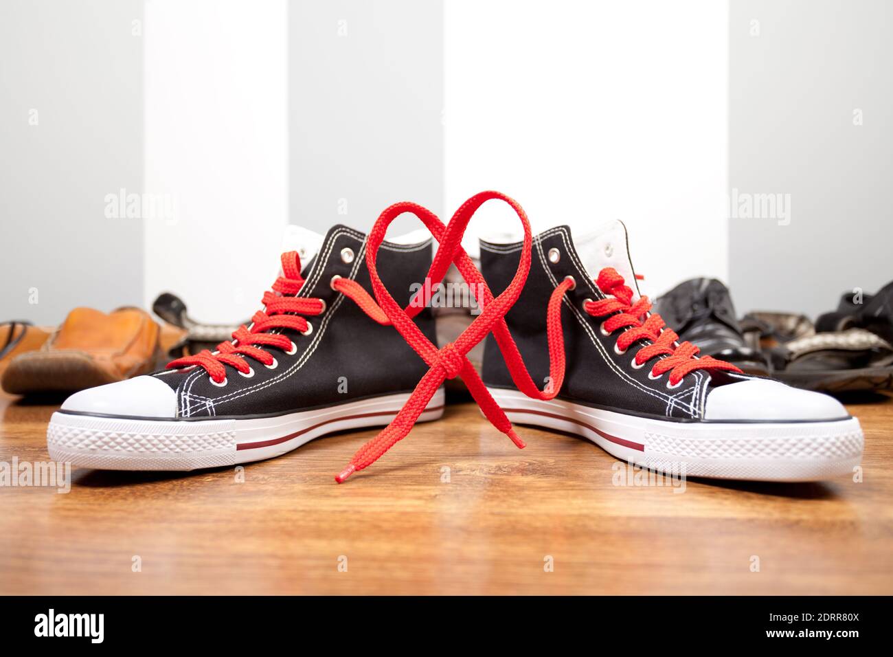 Hi-Top Black Sneakers with red laces 