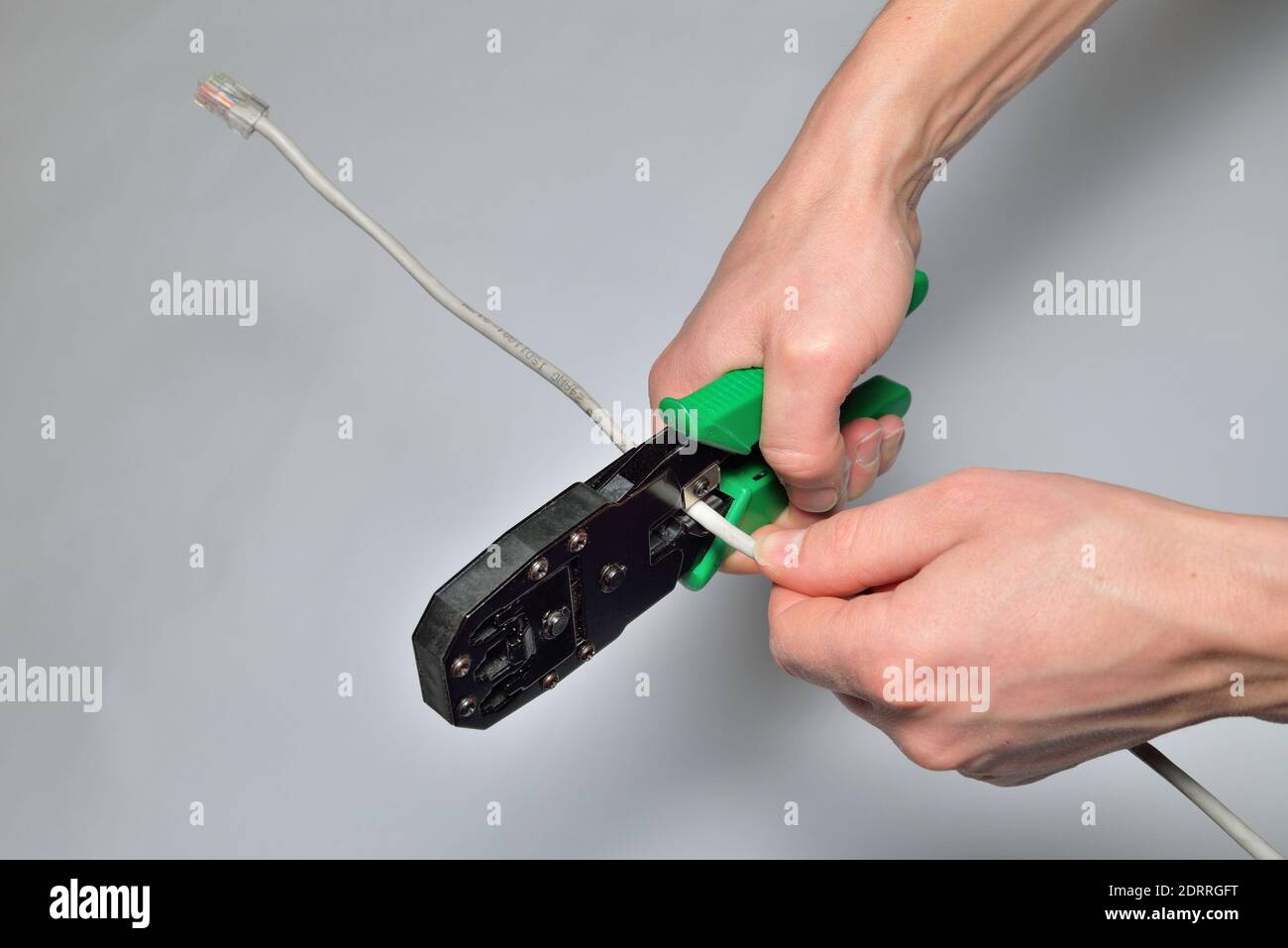 Cutting computer network cable mites Stock Photo - Alamy