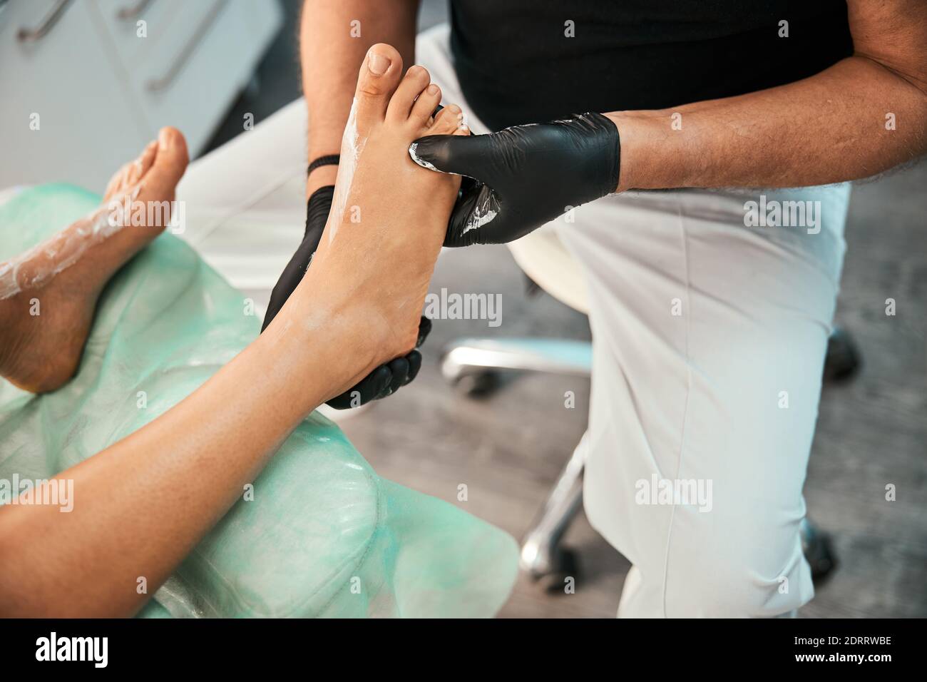 Competent podiatrist doing professional medical foot massage Stock Photo Alamy