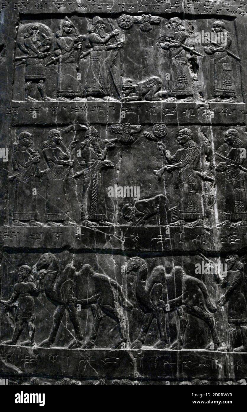 Assyrian culture. The Black Obelisk of Shalmaneser III. Black limestone. Bas-relief depicting military campaigns and receiving tribute, 858-824 BC. The Shalmaneser receives tribute from Iaua (Jesu) of the House of Omri (ancient northern Israel). From Nimrud, Iraq. British Museum. London, England, United Kingdom. Stock Photo