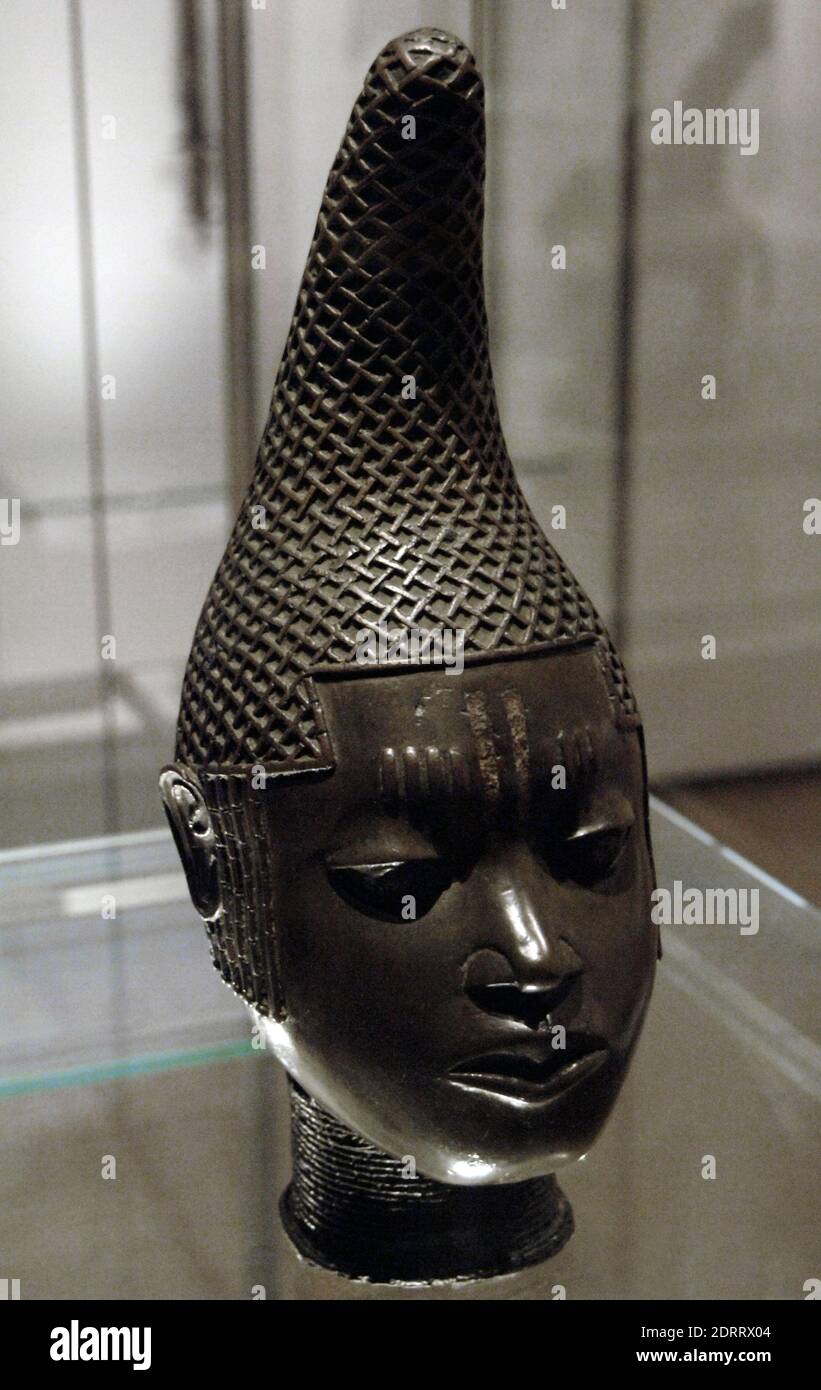 Commemorative head of Queen Mother. Lost-wax cast in brass. life-size female head with curving conical hairstyle covered. Early 16th century. Benin. British Museum. London, England, United Kingdom. Stock Photo