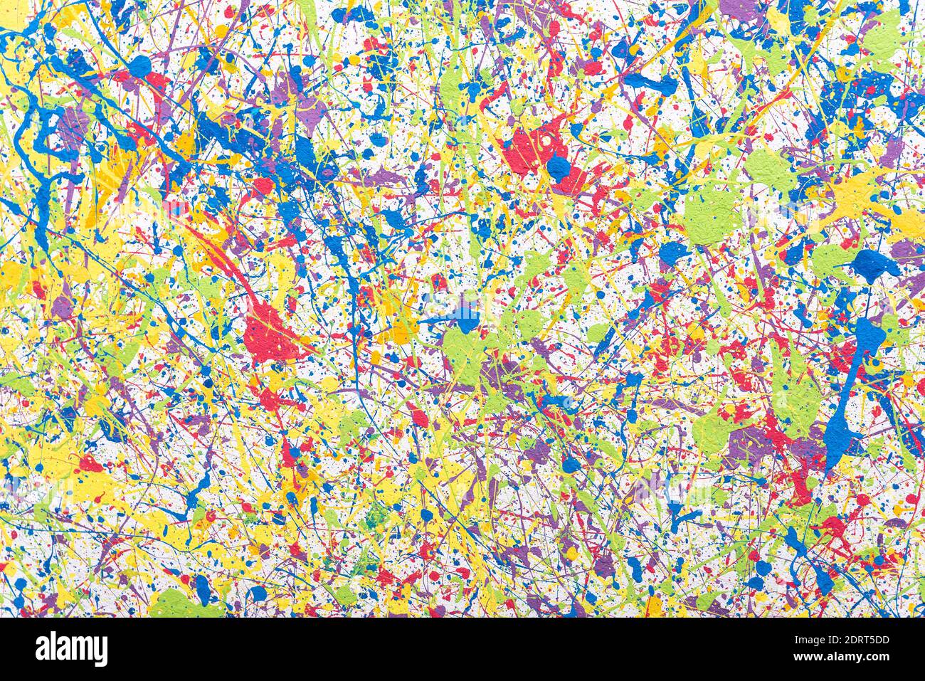 Multi-colored splashes of paint on the wall. Colored background. Stock Photo