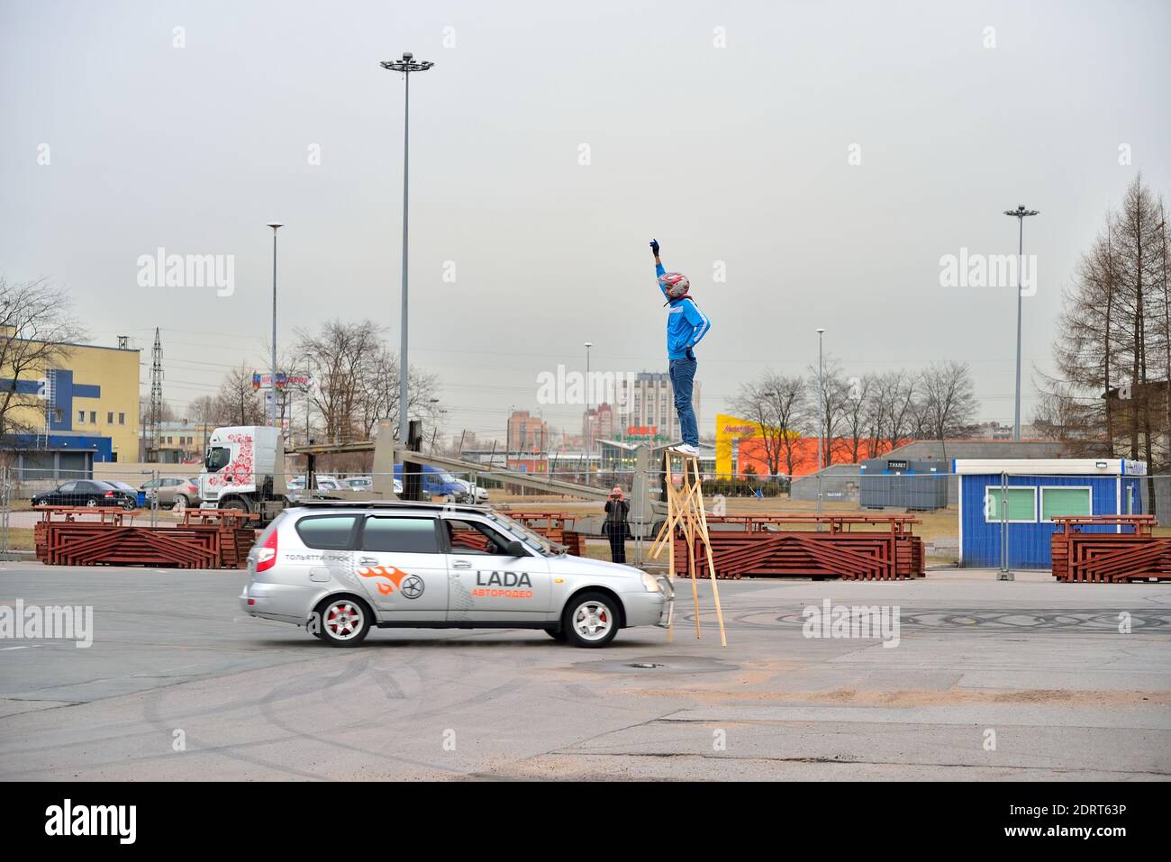ST.PETERSBURG, RUSSIA - APRIL 07, 2017: Car Lada Priora knocks pedestal stunt during the show, Lada-truck Rodeo thing in St. Petersburg Stock Photo