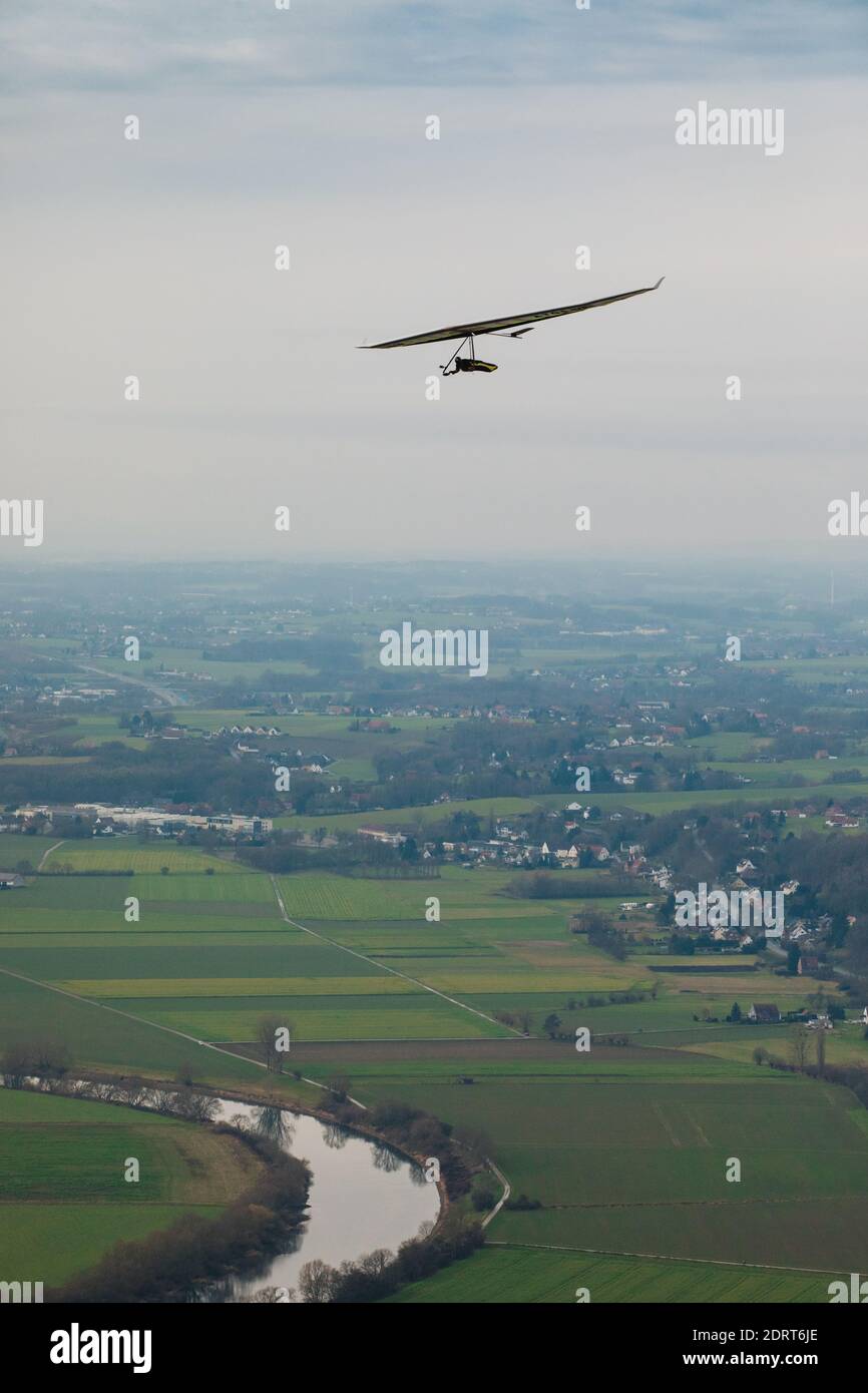 Hang glider in the air on a sunny day. Stock Photo