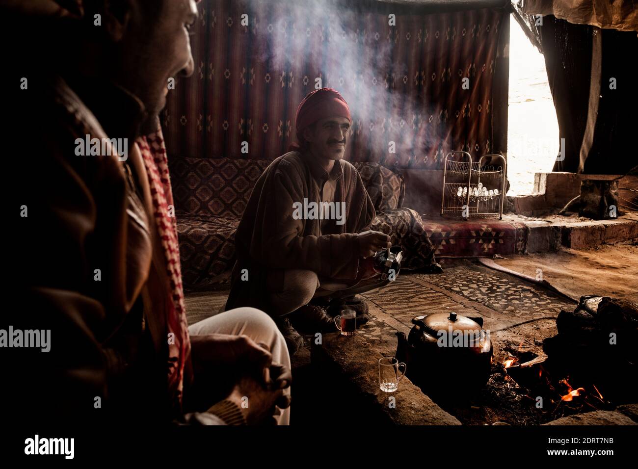 Bedouins in their tent camp doing traditional tea. Desert of Wadi Rum, Jordan, just a few weeks before the global lockdown Stock Photo